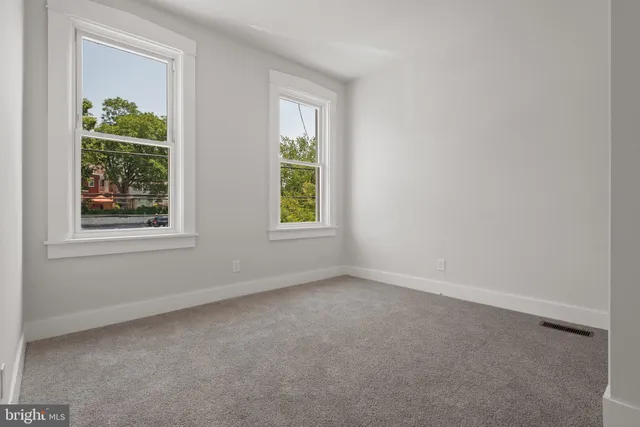 an empty room with windows