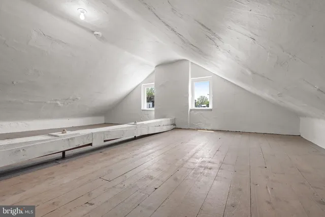 a view of a balcony with wooden floor