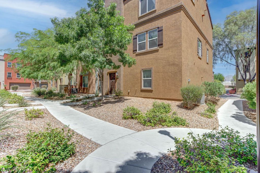 4650 Ranch House Road, Unit 47 North Las Vegas, NV 89031 - Photo 39 of 43 A graceful paved path guides to the inviting entry of this multi-story residence.
