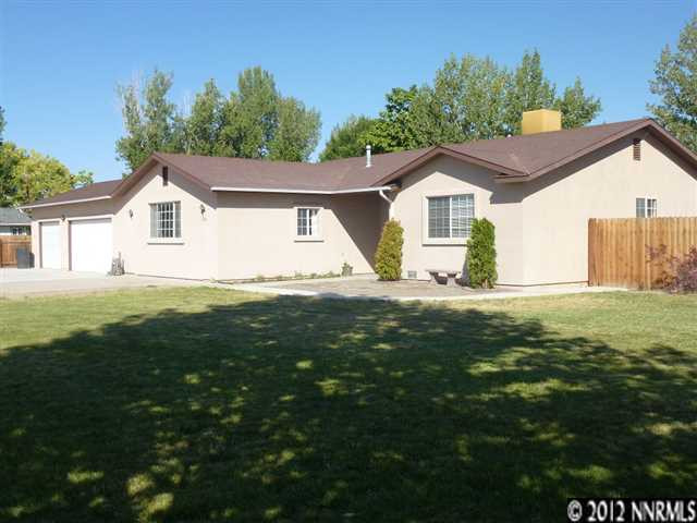 3260 Rice Road Fallon, NV 89406 - Photo 1 of 1 a front view of a house with a garden