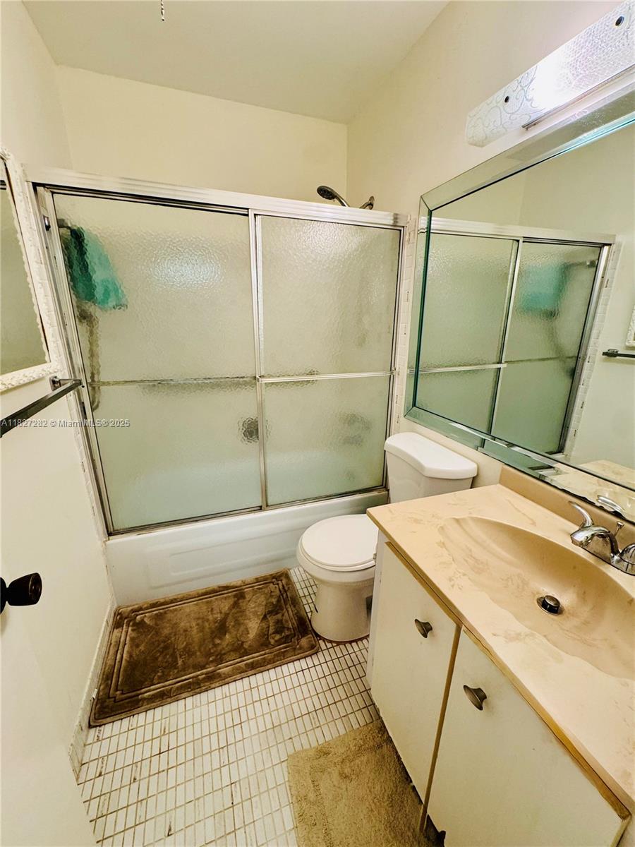 5641 Southwest 2nd Court, Unit 210 Margate, FL 33068 - Photo 14 of 36 a bathroom with a sink toilet and shower