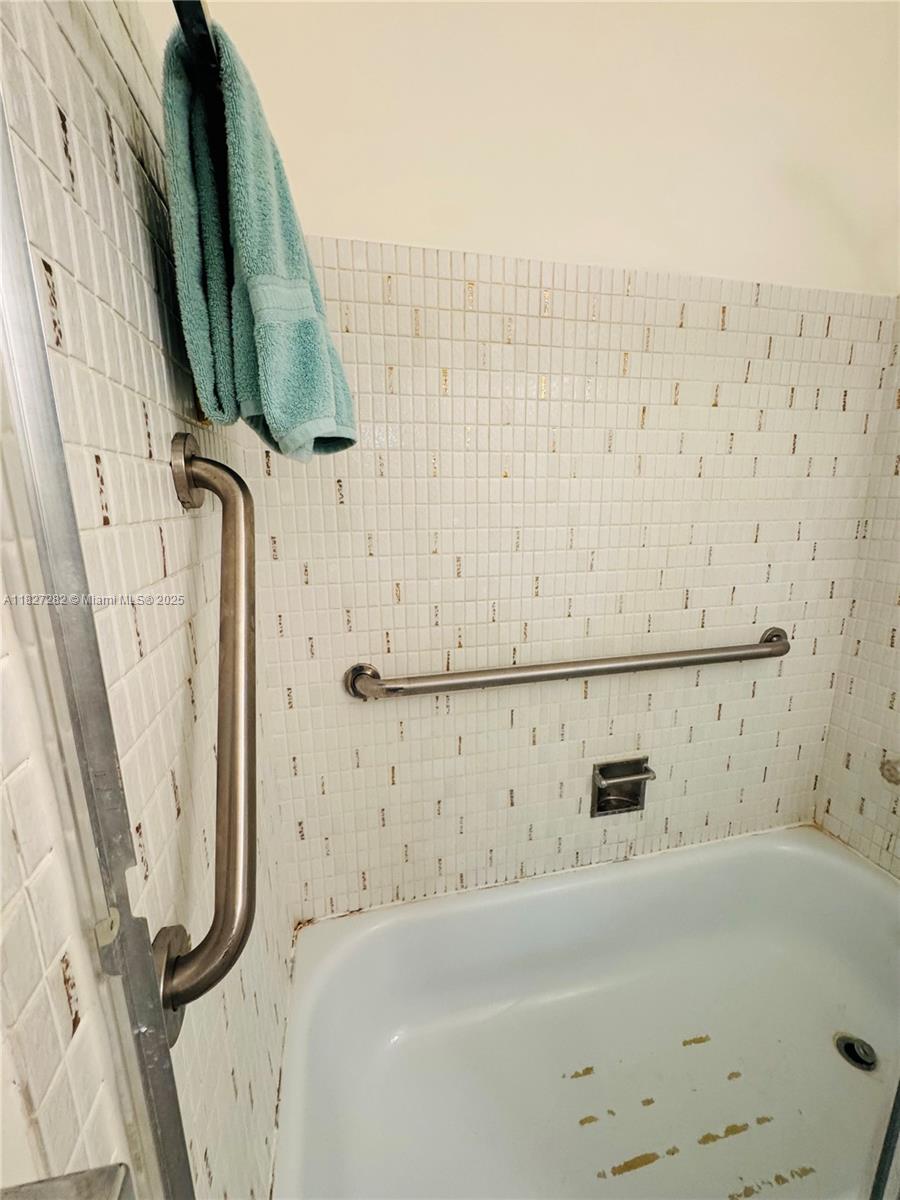 5641 Southwest 2nd Court, Unit 210 Margate, FL 33068 - Photo 15 of 36 a bathroom with a bathtub