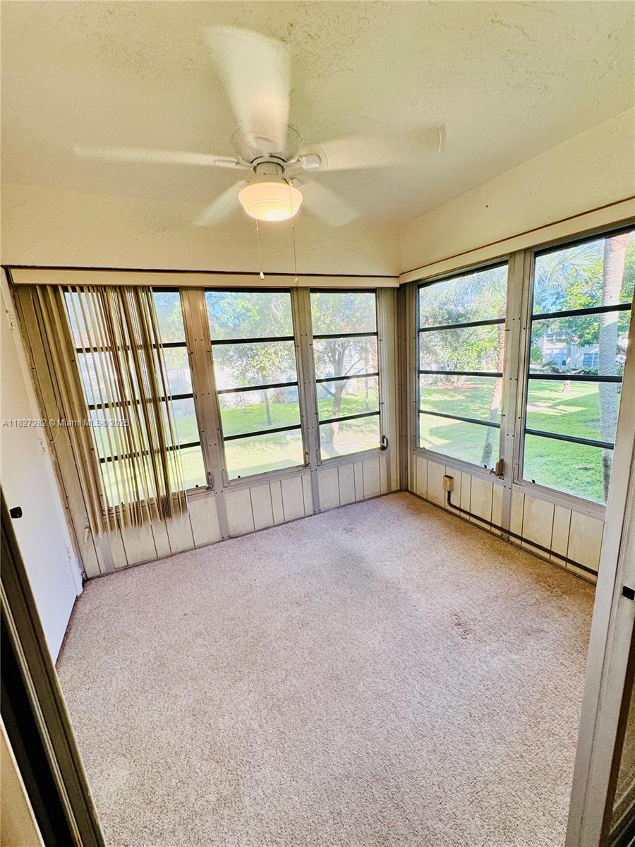 5641 Southwest 2nd Court, Unit 210 Margate, FL 33068 - Photo 26 of 36 a view of an empty room with a window