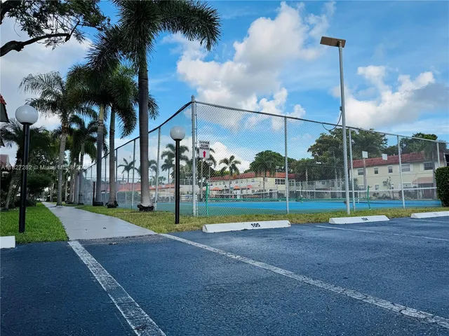 a view of a park with large trees