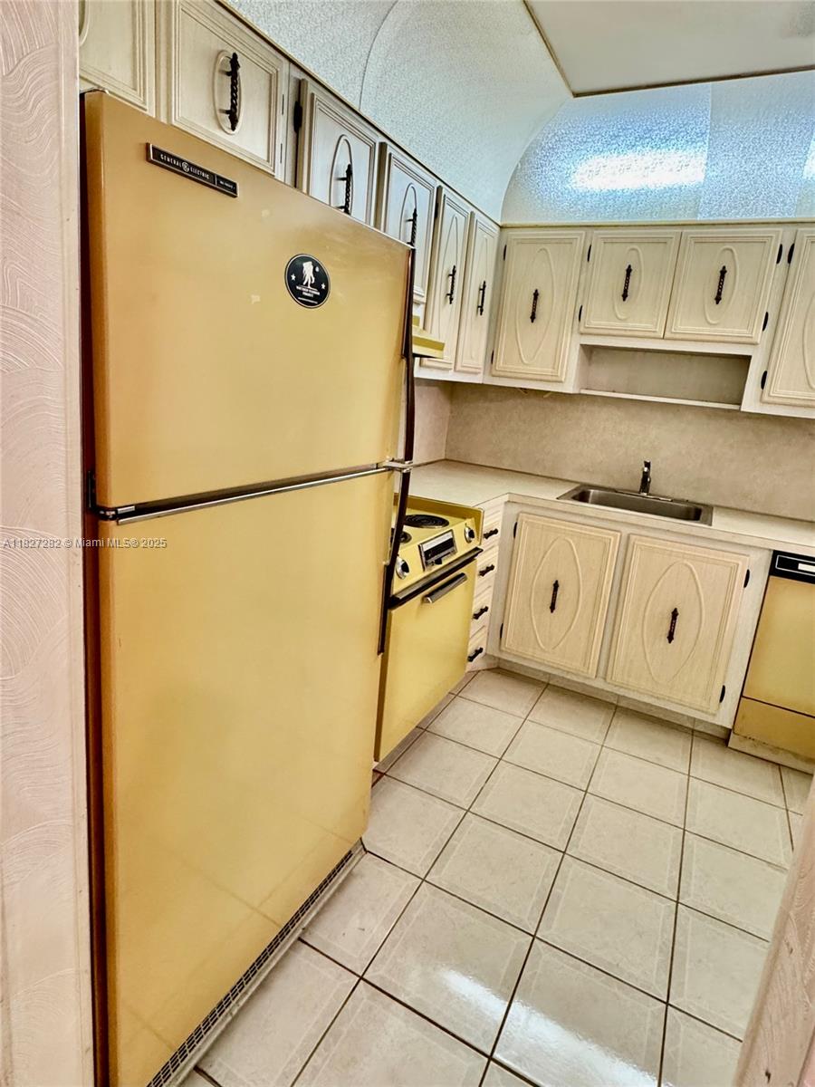 5641 Southwest 2nd Court, Unit 210 Margate, FL 33068 - Photo 7 of 36 a kitchen with stainless steel appliances a refrigerator and a stove