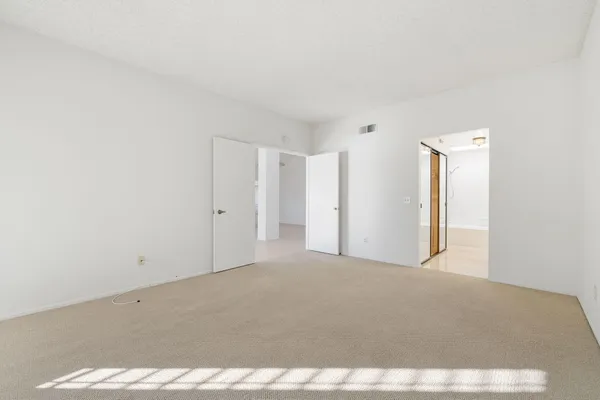 a view of an empty walk in closet