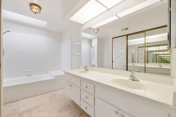 a bathroom with a white bath tub