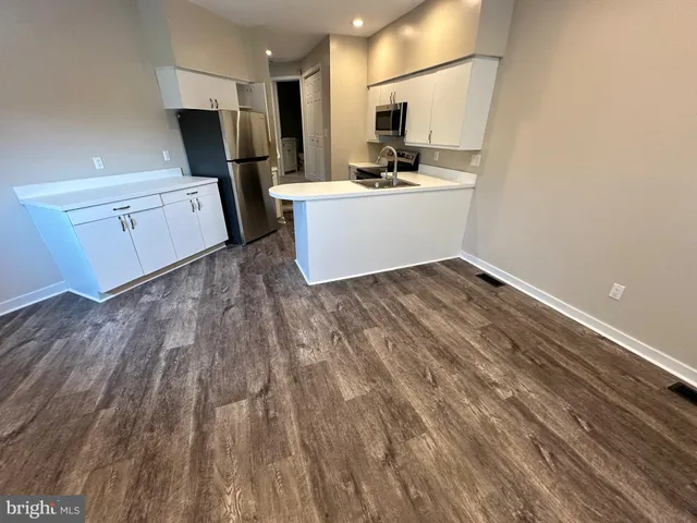 a view of kitchen with wooden floor