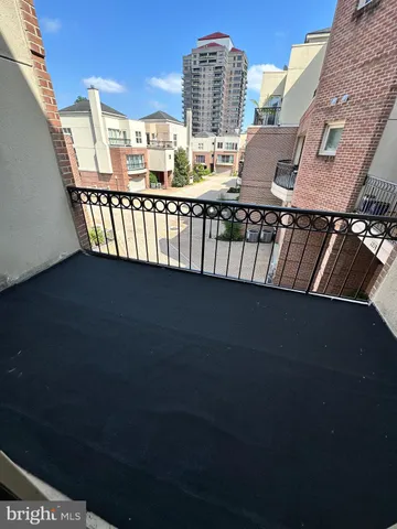 a view of a balcony with two windows