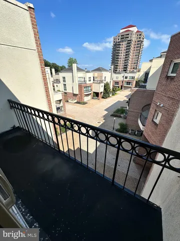 a view of swimming pool from a balcony