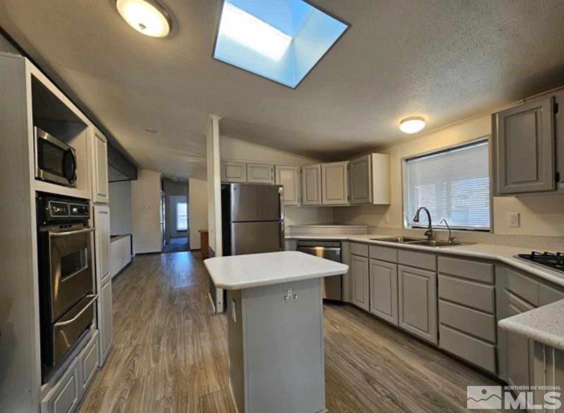16355 Rhyolite Circle Reno, NV 89521 - Photo 1 of 26 a kitchen with stainless steel appliances granite countertop a sink stove and refrigerator