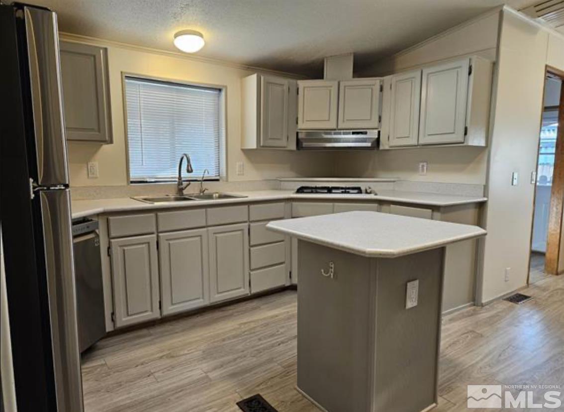 16355 Rhyolite Circle Reno, NV 89521 - Photo 14 of 26 a kitchen with stainless steel appliances granite countertop a sink and cabinets