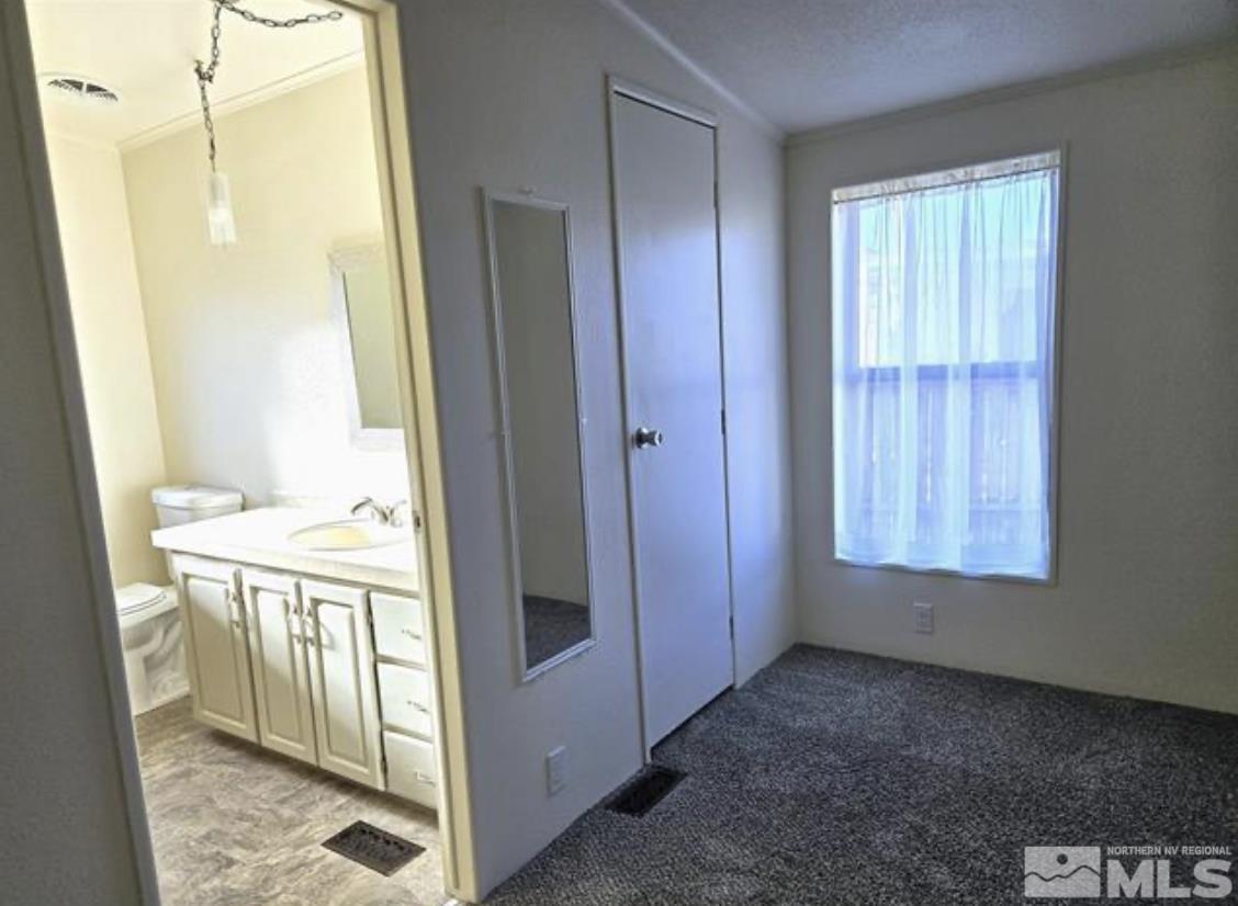 16355 Rhyolite Circle Reno, NV 89521 - Photo 17 of 26 a view of a bathroom with a sink and a mirror