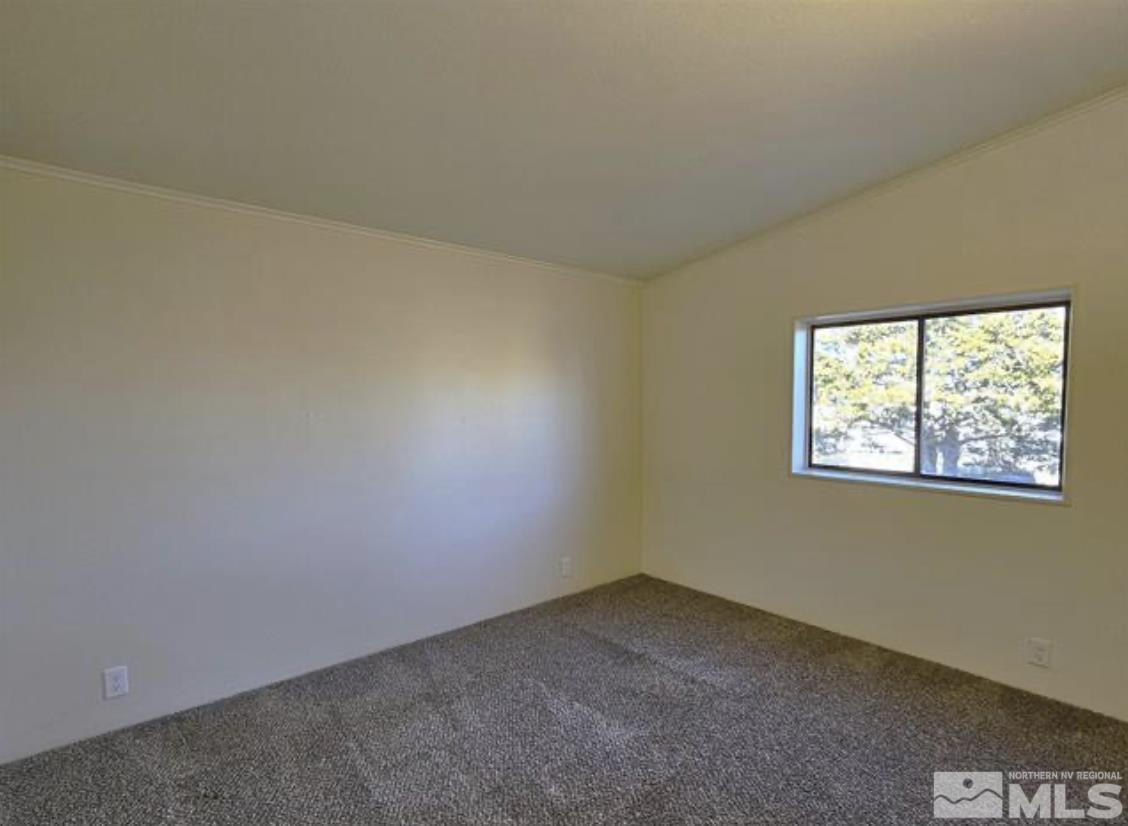 16355 Rhyolite Circle Reno, NV 89521 - Photo 25 of 26 an empty room with a window