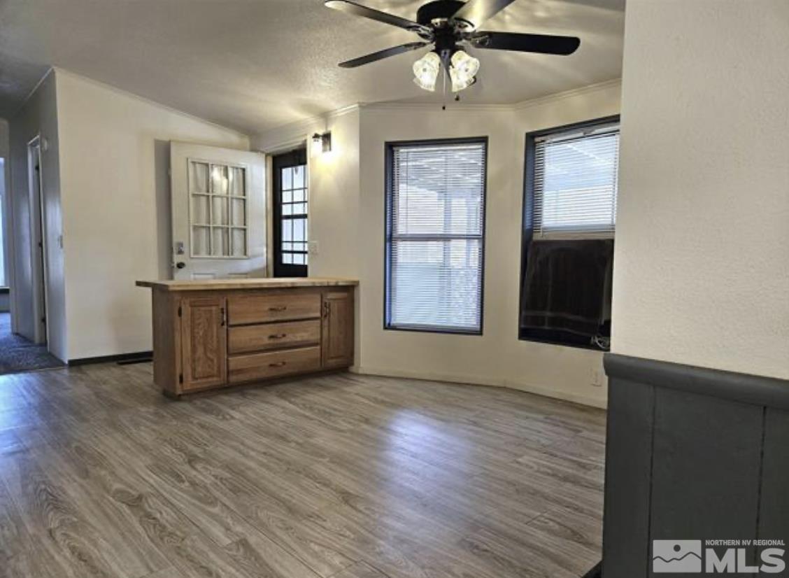 16355 Rhyolite Circle Reno, NV 89521 - Photo 8 of 26 an empty room with windows and cabinet