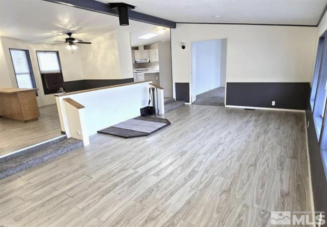 16355 Rhyolite Circle Reno, NV 89521 - Photo 9 of 26 wooden floor in an empty room with a window