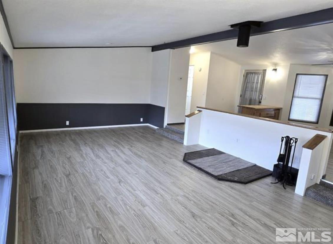 16355 Rhyolite Circle Reno, NV 89521 - Photo 10 of 26 a view of an empty room and wooden floor