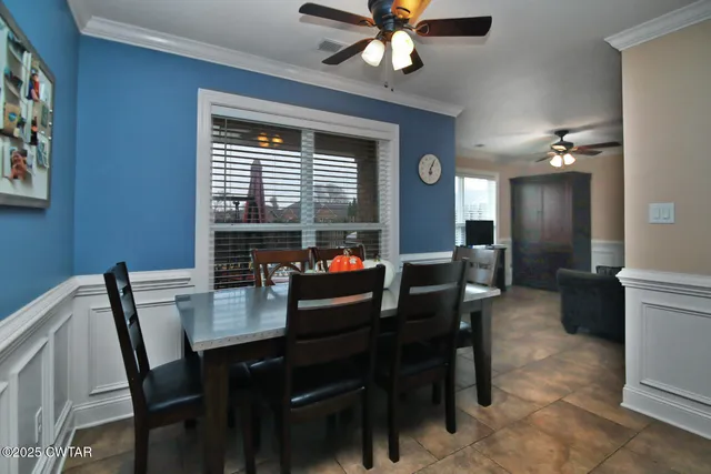 a dining room with furniture and window