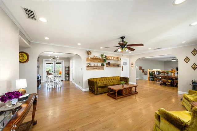 a view of a dining room with furniture and wooden floor