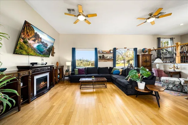 a view of a balcony with two chairs and a table