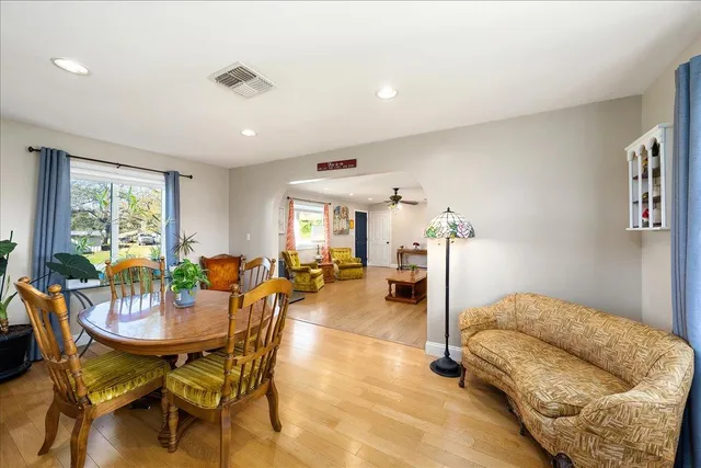 a living room with furniture fireplace and a flat screen tv