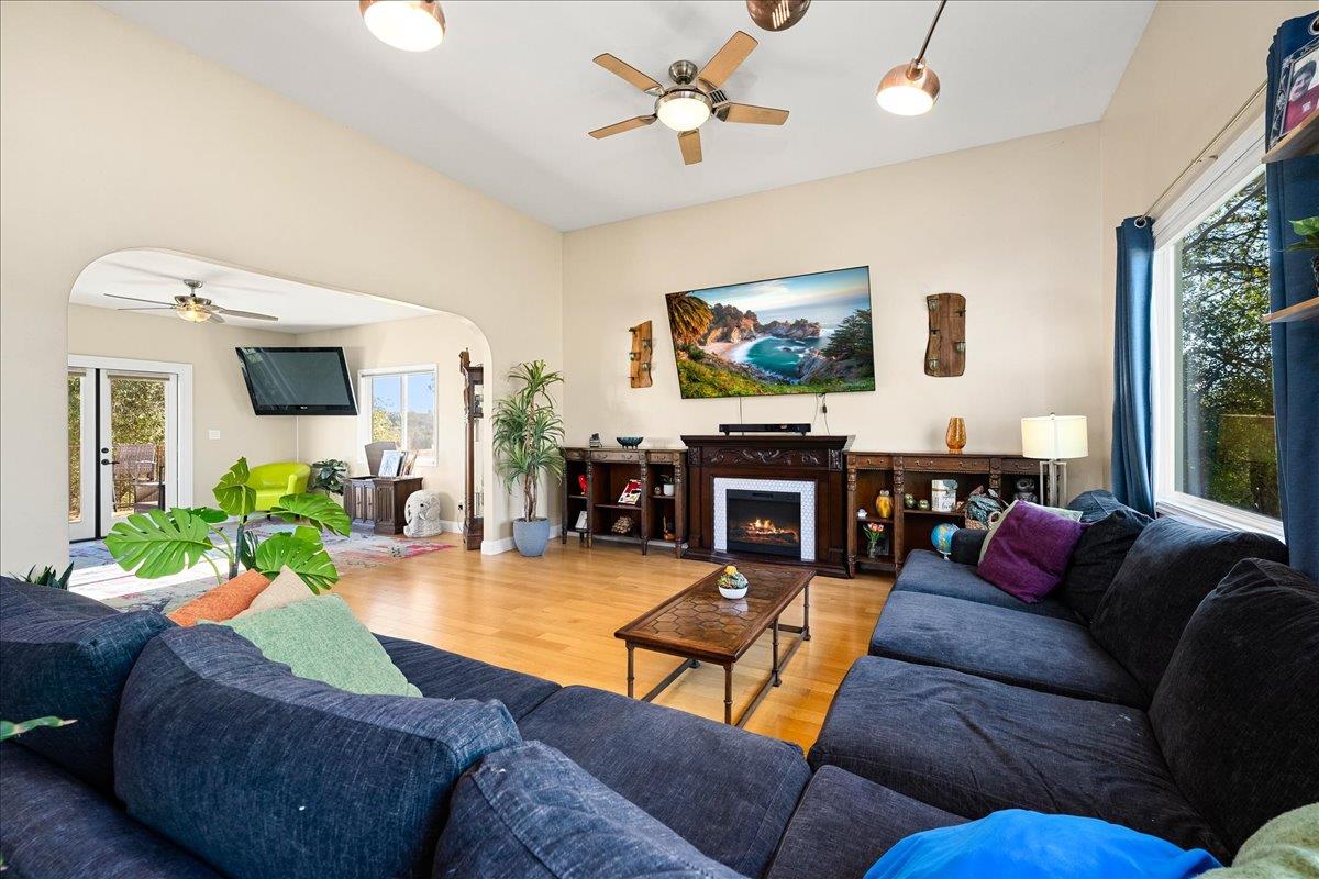 4371 Luneman Road Placerville, CA 95667 - Photo 23 of 77 a living room with furniture a flat screen tv and a fireplace