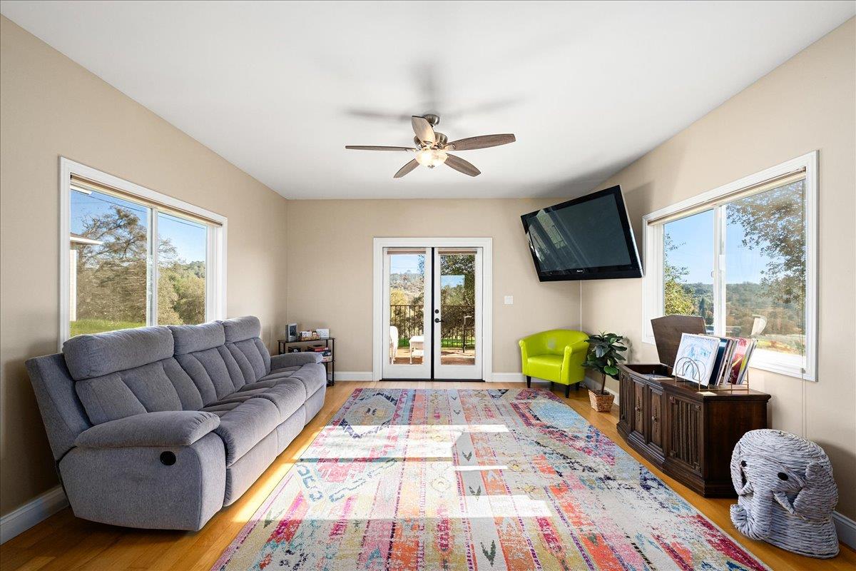 4371 Luneman Road Placerville, CA 95667 - Photo 25 of 77 a living room with furniture fireplace and a flat screen tv