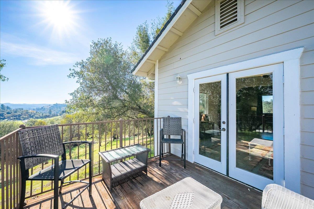 4371 Luneman Road Placerville, CA 95667 - Photo 27 of 77 a view of a balcony with two chairs and a table