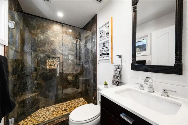 a bedroom with furniture and a wooden floor