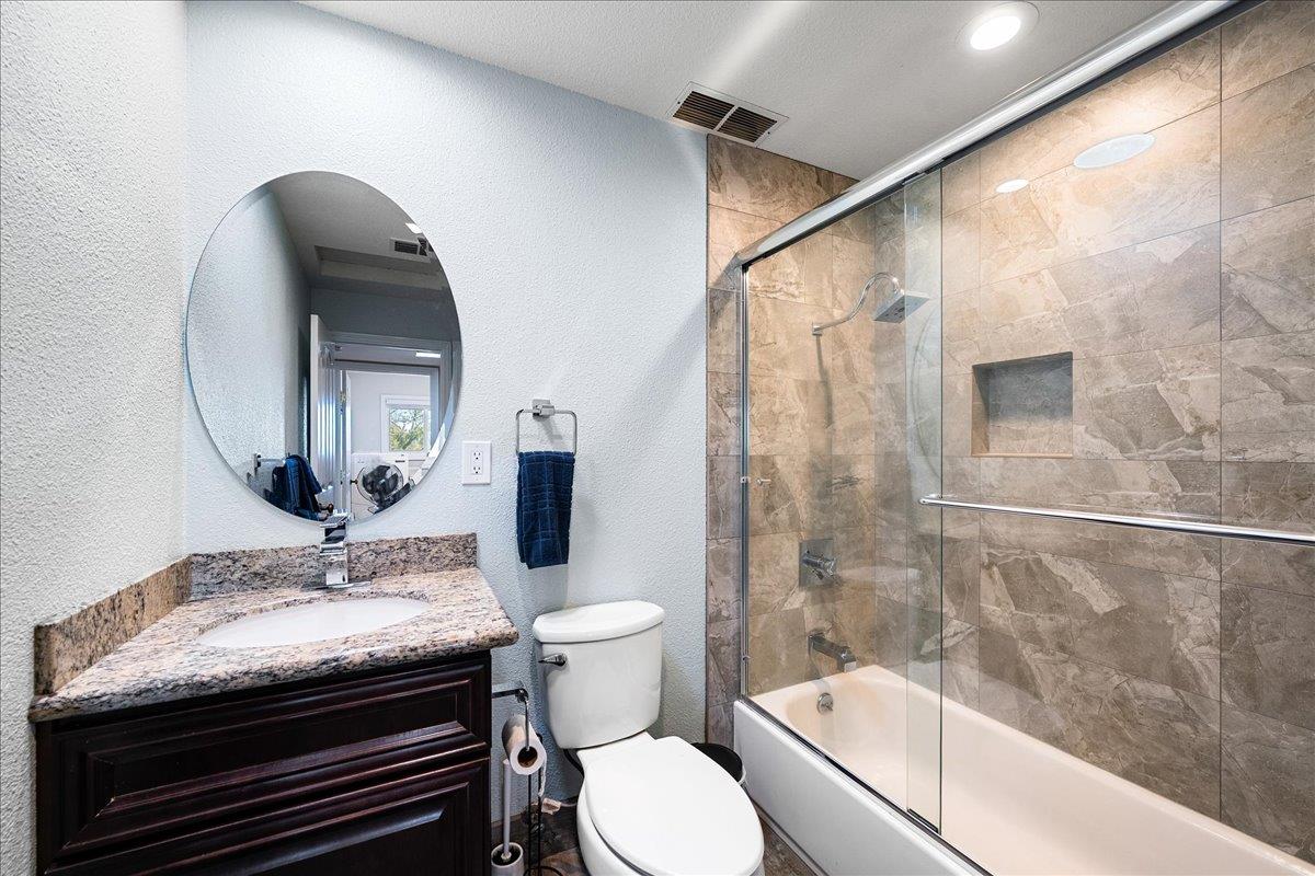 4371 Luneman Road Placerville, CA 95667 - Photo 29 of 77 a bathroom with a granite countertop sink toilet and shower
