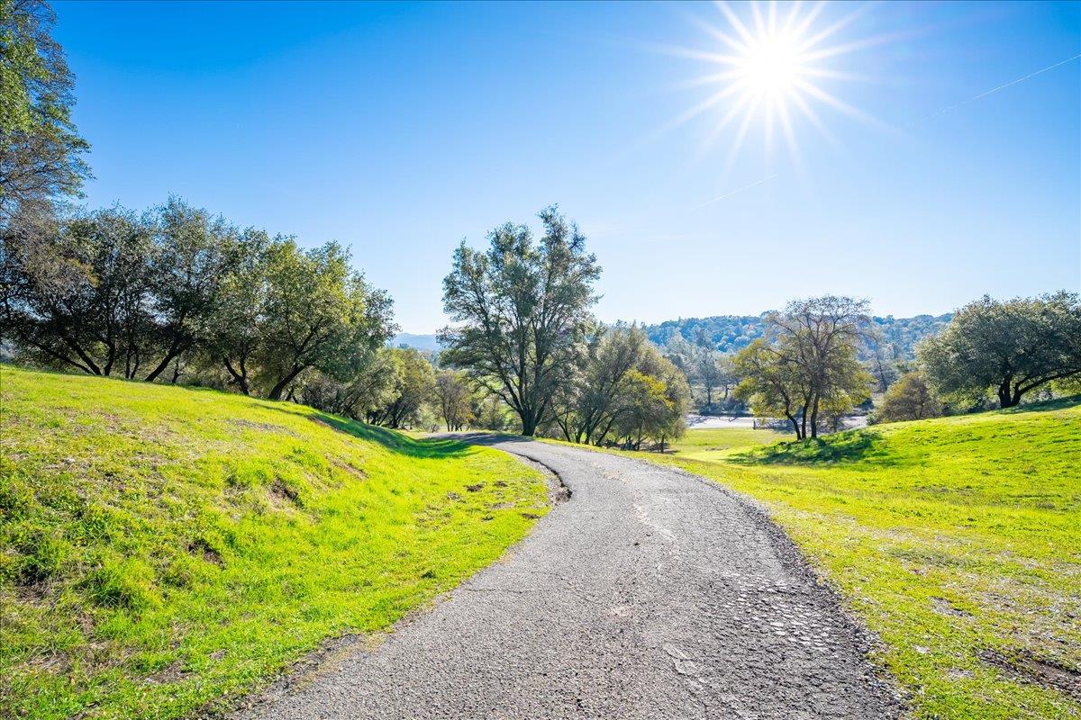 4371 Luneman Road Placerville, CA 95667 - Photo 4 of 77 a view of a swimming pool with an outdoor space and seating area