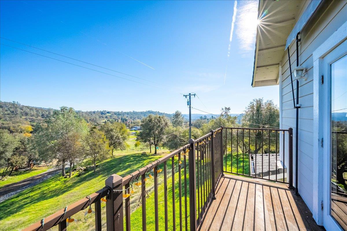 4371 Luneman Road Placerville, CA 95667 - Photo 43 of 77 a view of a balcony with wooden floor and fence