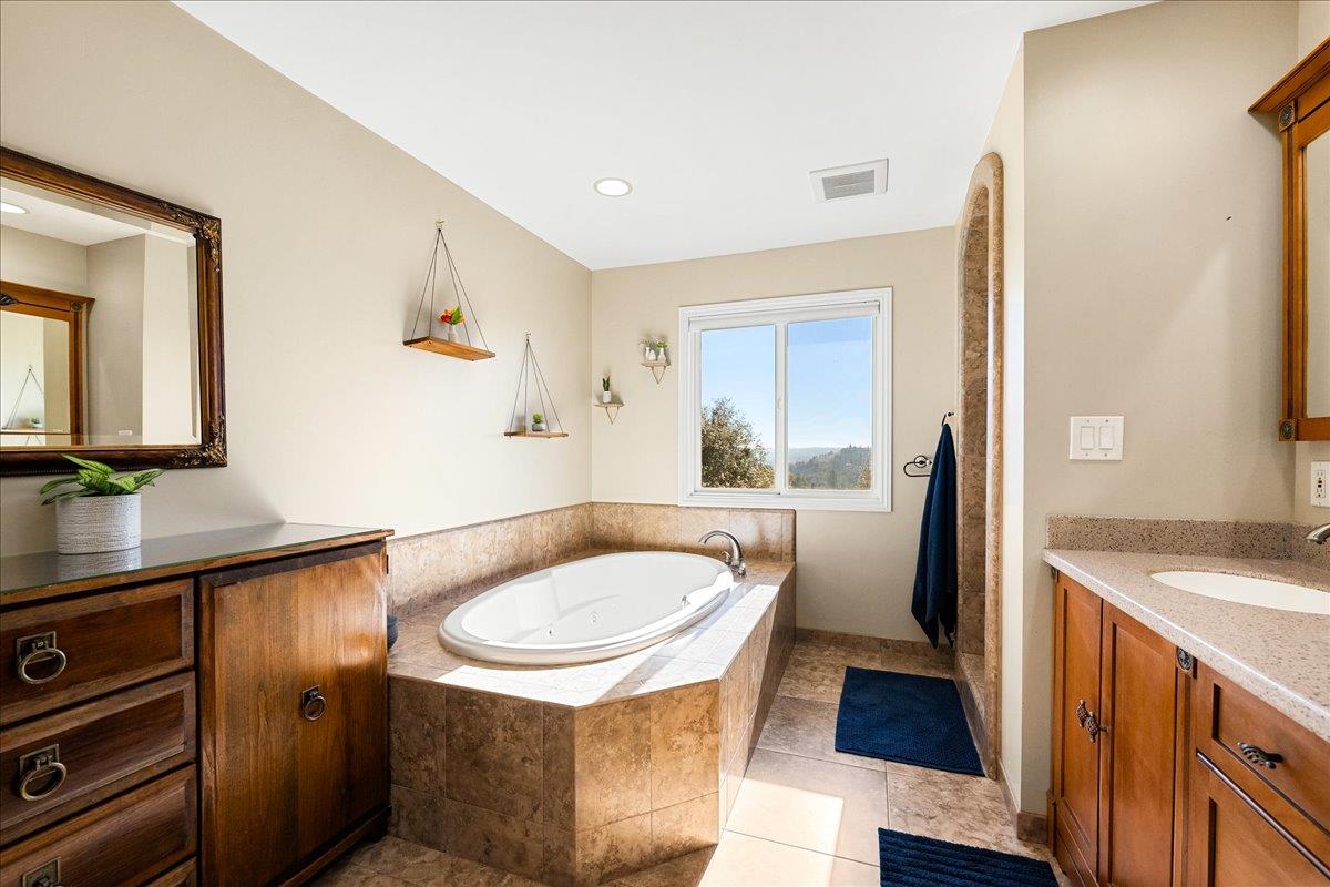 4371 Luneman Road Placerville, CA 95667 - Photo 45 of 77 a bathroom with a sink and a mirror