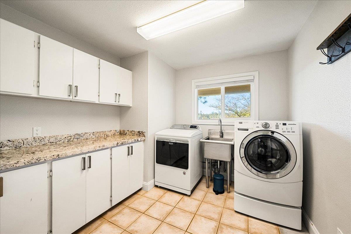 4371 Luneman Road Placerville, CA 95667 - Photo 48 of 77 a kitchen with a stove top oven sink and cabinets