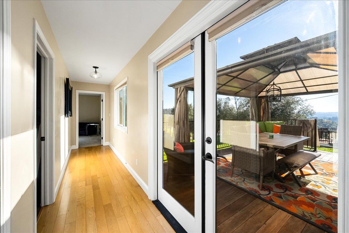 4371 Luneman Road Placerville, CA 95667 - Photo 50 of 77 a view of a hallway with wooden floor and furniture