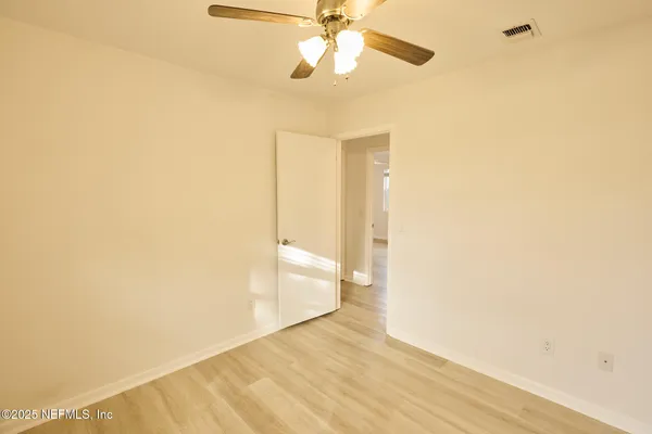 a view of a house with a backyard and a patio