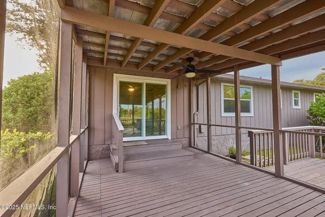 a view of balcony with deck and wooden floor