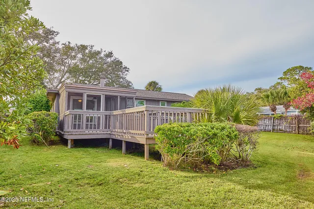 a view of a house with backyard porch and furniture