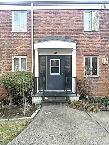 a front view of a house with stairs