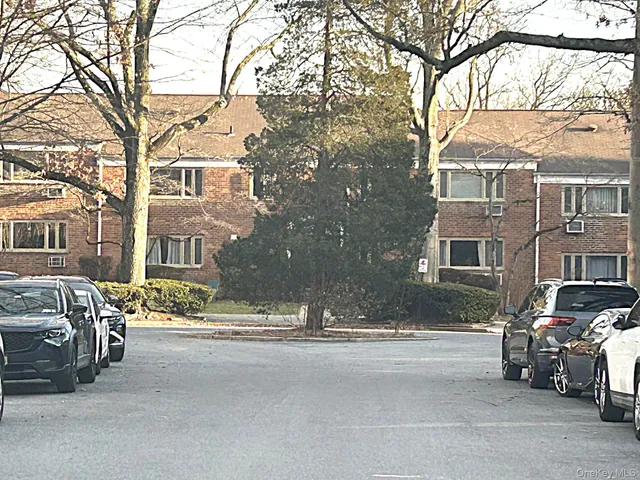 a city street lined with buildings and cars