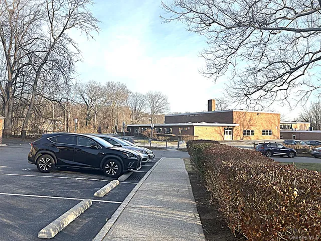 a view of a car park in front of a building