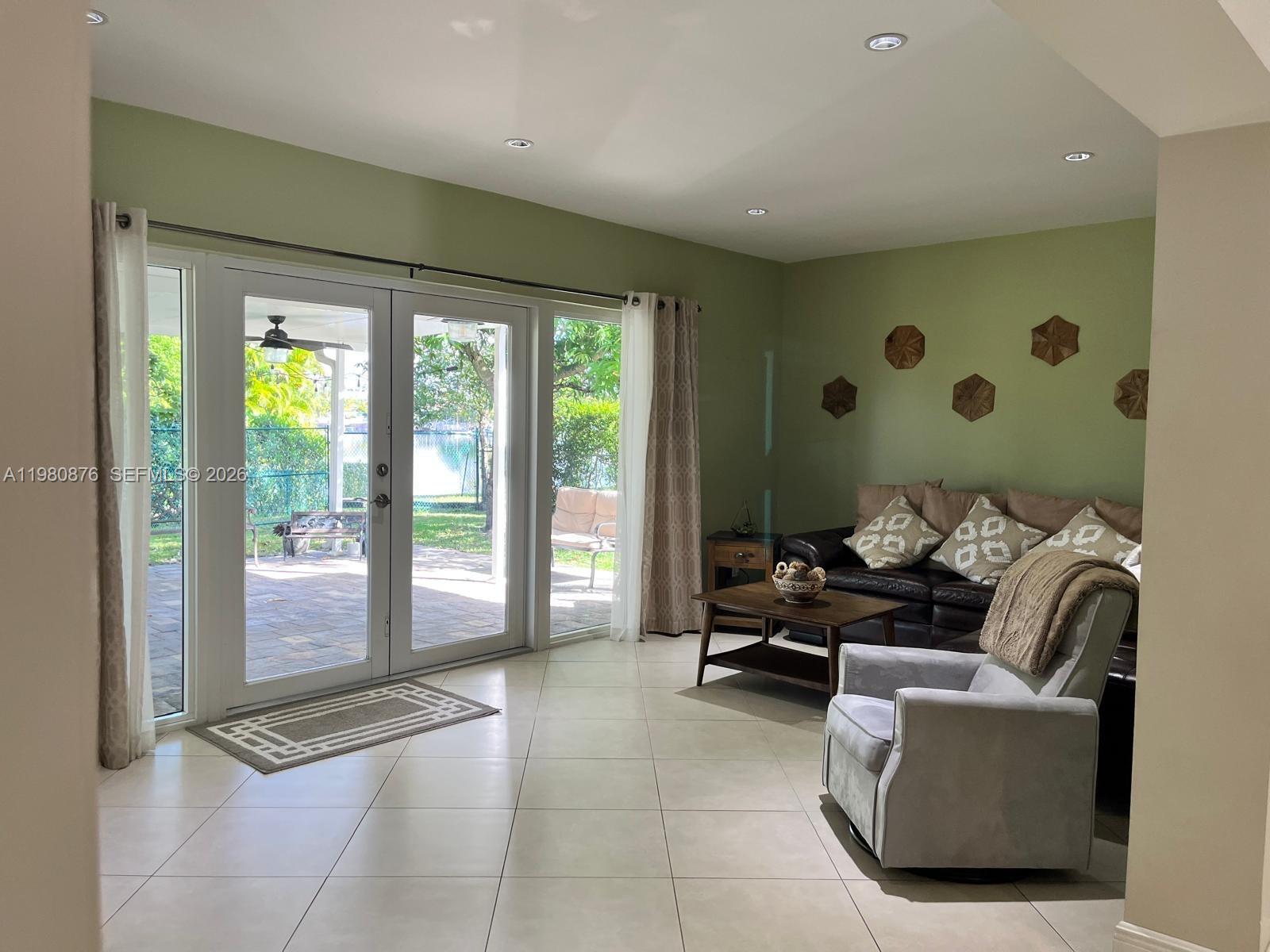 685 West 77th Street Hialeah, FL 33014 - Photo 11 of 35 a living room with furniture and a large window