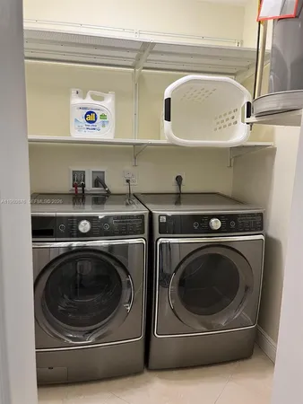 a utility room with dryer and washer
