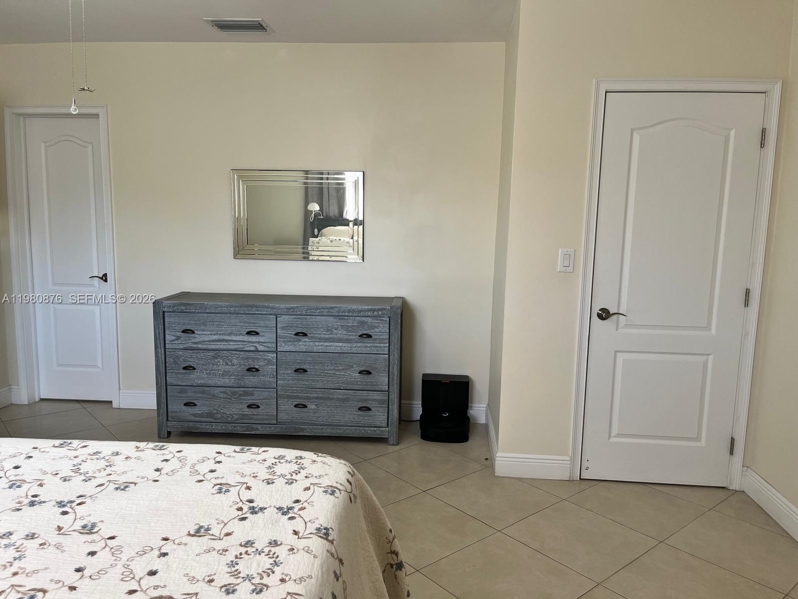 685 West 77th Street Hialeah, FL 33014 - Photo 16 of 35 a view of a bedroom with closet and cabinet