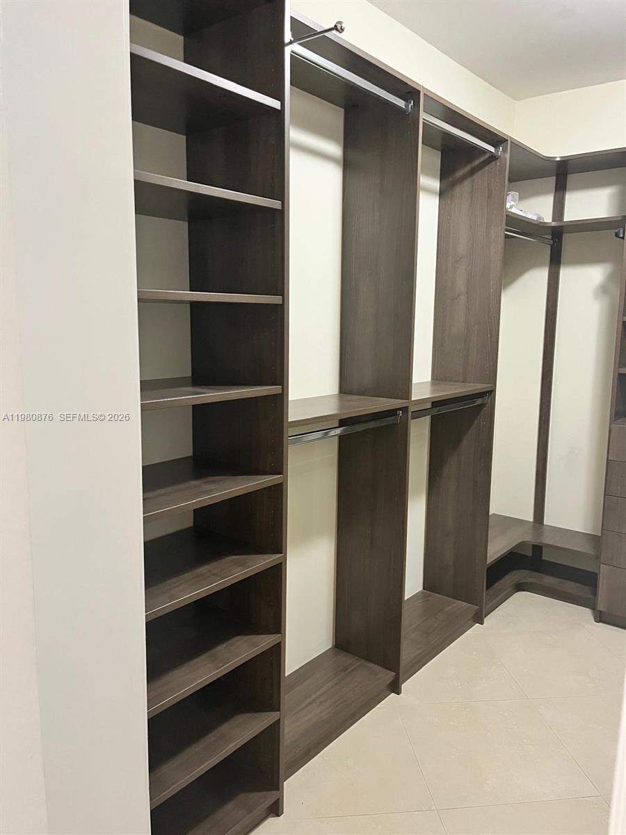 685 West 77th Street Hialeah, FL 33014 - Photo 17 of 35 a view of walk in closet with empty racks