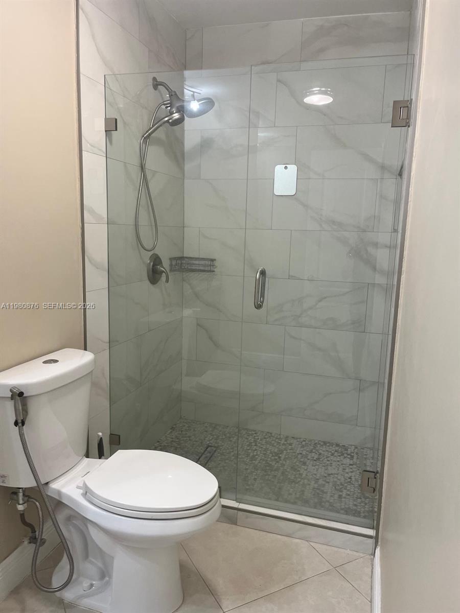 685 West 77th Street Hialeah, FL 33014 - Photo 19 of 35 a bathroom with a toilet and a shower