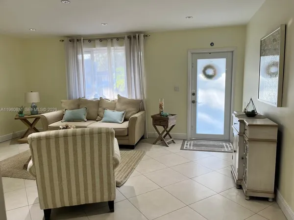 a living room with furniture and a window