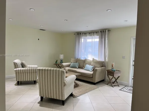 a living room with furniture and window