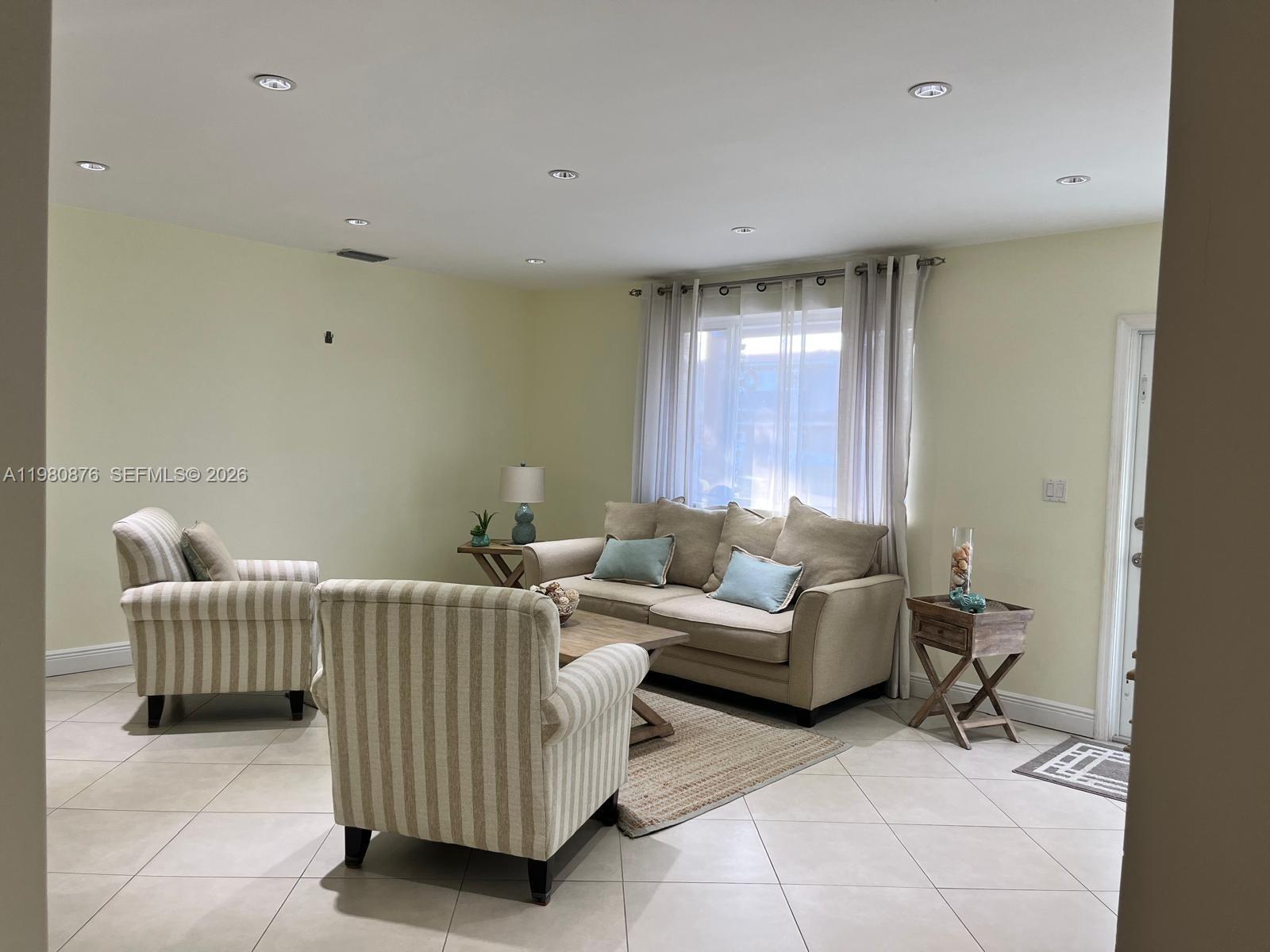 685 West 77th Street Hialeah, FL 33014 - Photo 5 of 35 a living room with furniture and window