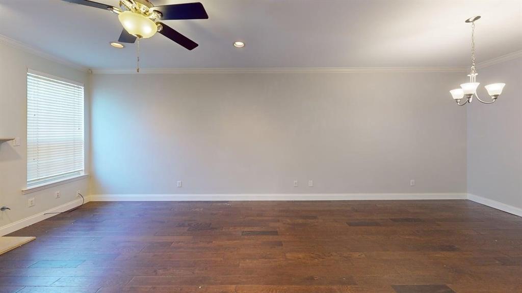 18240 Midway Road, Unit 1204 Dallas, TX 75287 - Photo 21 of 27 wooden floor in an empty room with a window